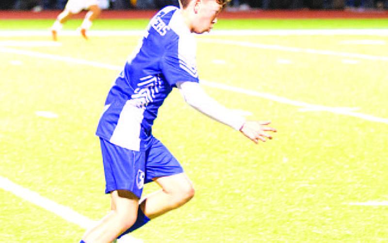 HUNTER KING | DISPATCH RECORD Kent Ashley dribbles through the midfield during last Friday’s match against Stephenville.