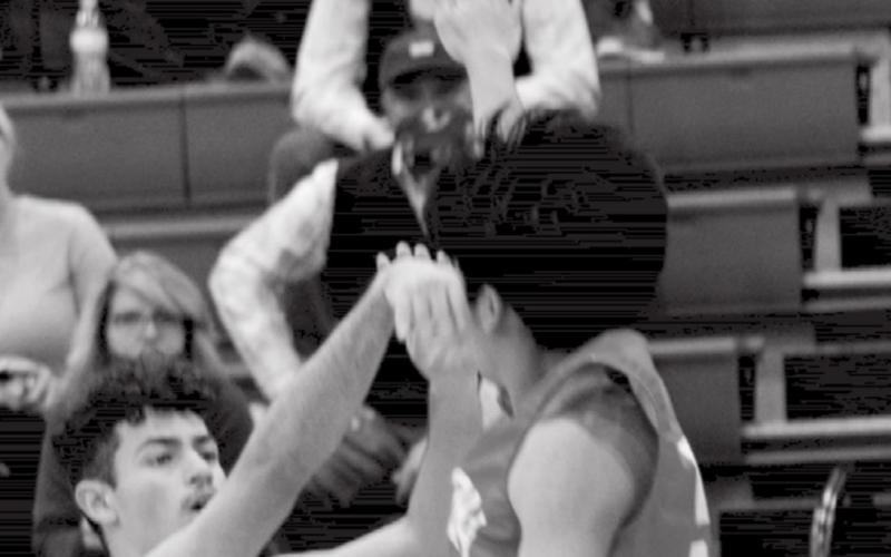 Anthony Ortiz, left, makes one of the seven three-pointers that Lampasas had in the first quarter on Wednesday. JEFF LOWE | DISPATCH RECORD