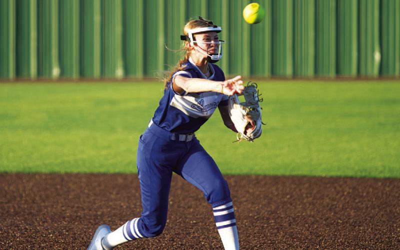 HUNTER KING | DISPATCH RECORD Sagen Plouff throws from second base to first base to record an out early in Tuesday’s game.