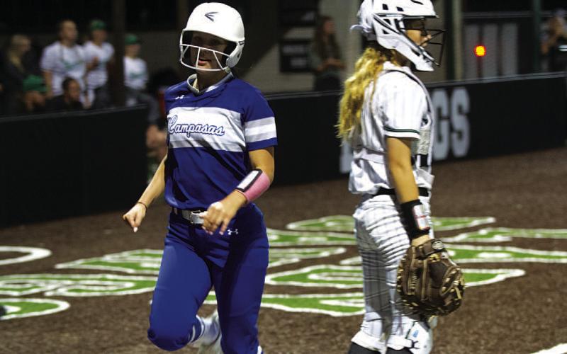 HUNTER KING | DISPATCH RECORD Bre Quarles jogs into home plate to score one of the Lady Badgers’ three runs.
