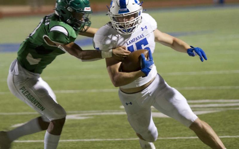 Case Brister attempts to make a defender miss while running down the sideline in the Badgers’ first-round playoff game against Pleasanton last Friday. HUNTER KING | DISPATCH RECORD