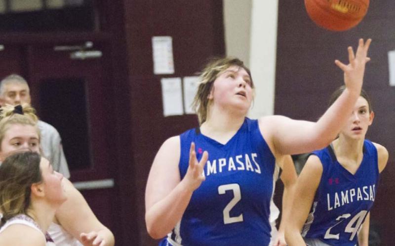Morgan Lovejoy (2) reaches for control of the ball in Friday’s district road game against Brownwood. JEFF LOWE | DISPATCH RECORD