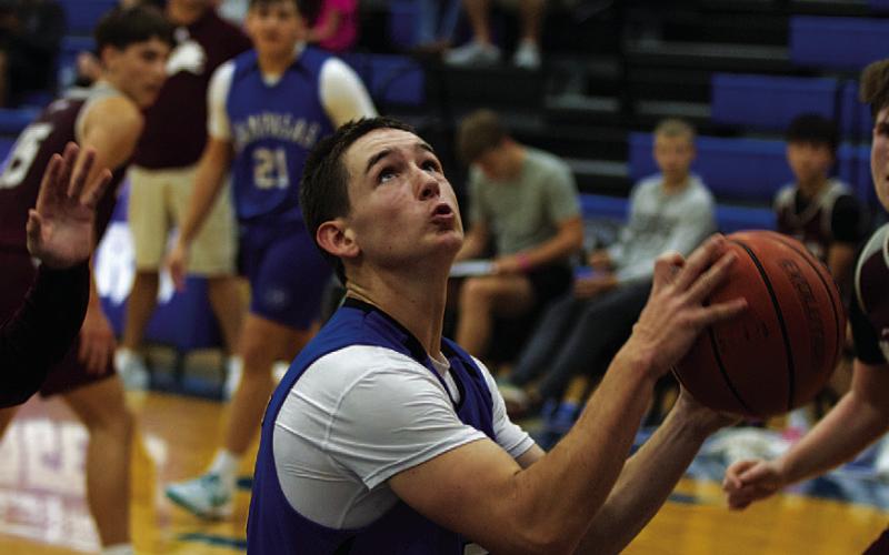 HUNTER KING | DISPATCH RECORD JT Posten looks to go up for a layup during one of the Badgers’ scrimmages last Saturday.
