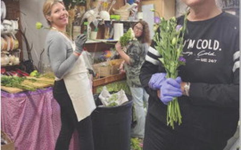 Gina Allman, Bridgette Leatherman and Elaine Leatherman, florists at The Shoppe on Key Avenue, process flowers on Wednesday in preparation for Valentine’s Day. COURTESY PHOTO | THE SHOPPE ON KEY AVENUE