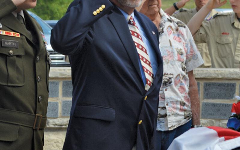 Gene Isenhour salutes during Kempner’s recent Memorial Day observance in honor of those servicemembers who died in the line of duty. erick mitchell | dispatch record