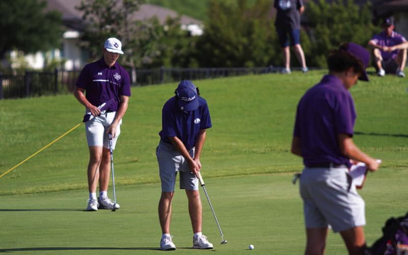 HUNTER KING | DISPATCH RECORD Peyton Spore makes a birdie putt during his second round of the state tournament.