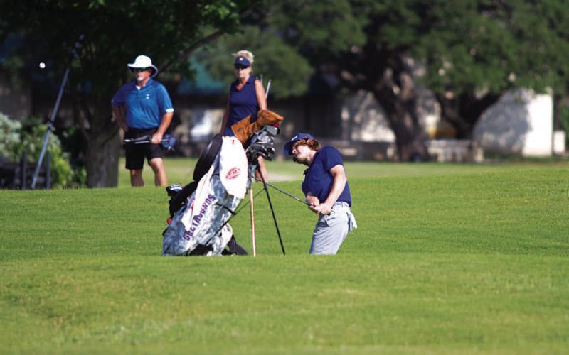HUNTER KING | DISPATCH RECORD Timber Gholson hits a chip shot from behind the green.