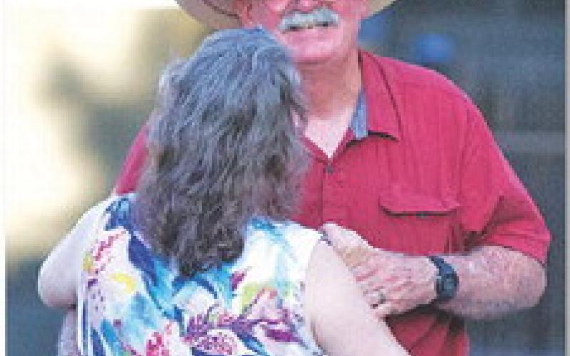 Stoney Holbrook dances with Teresa Holbrook on the street of the downtown square during last week’s dance. hunter king | Dispatch RecordE