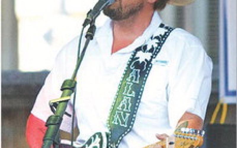 Alan Whitehead, lead singer for The Western Playboys, opened at the Go Texan Street Dance on Saturday night.