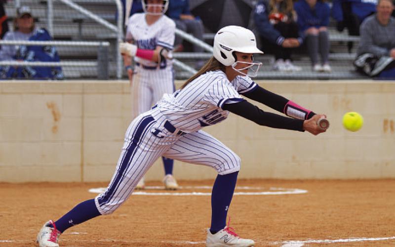 Kayli Syx lays down a perfect bunt for the Lady Badgers. The senior uses her speed as a weapon. HUNTER KING | DISPATCH RECORD