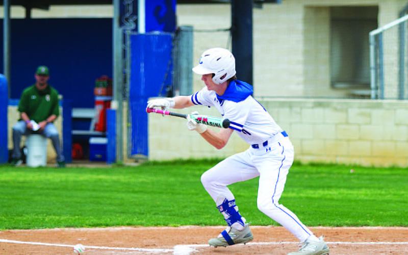 HUNTER KING | DISPATCH RECORD Peyton Sisson lays down a sacrifice bunt to advance a runner to second base.