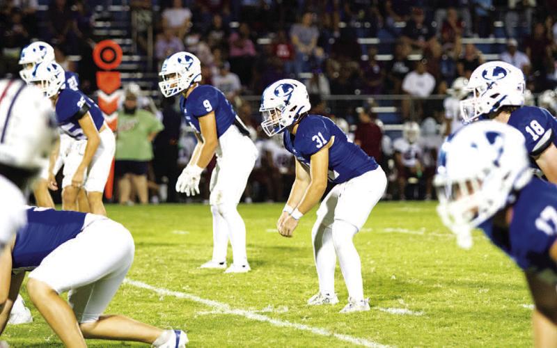 Tate Langford waits for the ball to be snapped in the contest. HUNTER KING | DISPATCH RECORD