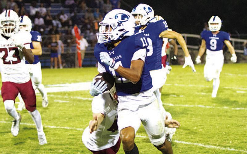 Jaden McElwain evades a defender on his long kickoff return. HUNTER KING | DISPATCH RECORD