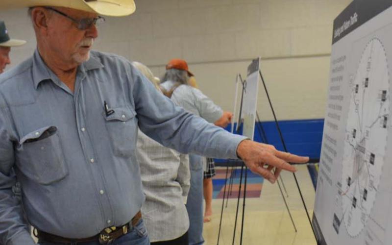 County Commissioner Bobby Carroll and wife Staria look over one of the exhibits on a relief study to ease traffic on the surrounding highways as drivers come through Lampasas. MONIQUE BRAND | DISPATCH RECORD