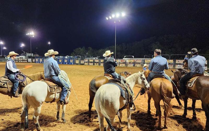 At far left is CPRA judge Bill Herbert, a former four-time CPRA saddle bronc champion. He awaits with entrants for the start of the team roping event at the Riata Roundup Rodeo, held last weekend at the 580 West Sports Complex in Lampasas. Teresa Thornton | dispatch record