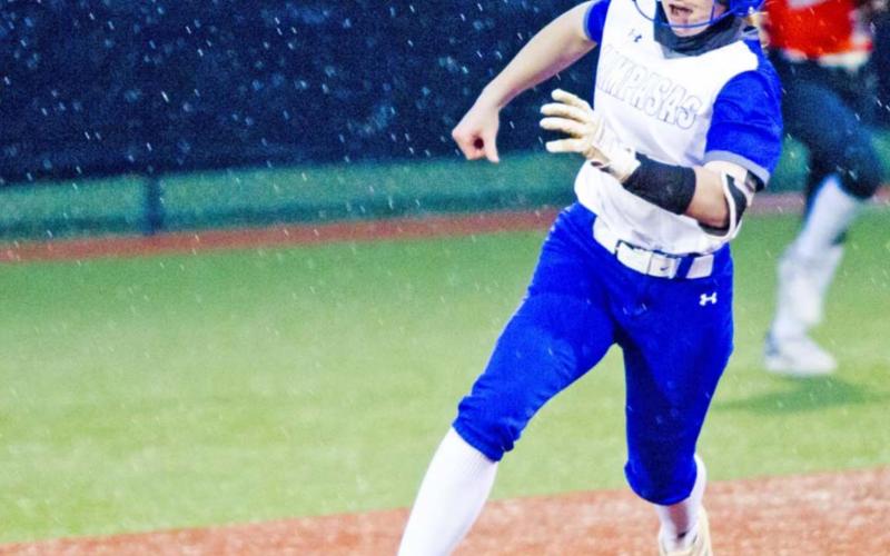 LHS freshman Aspen Wheeler rounds second base on a triple in game one of the bi-district playoffs. JEFF LOWE | DISPATCH RECORD