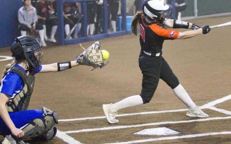 Kali Hunter catches a strike from Caitlyn Sanguinet in game two at Stephenville. JEFF LOWE | DISPATCH RECORD