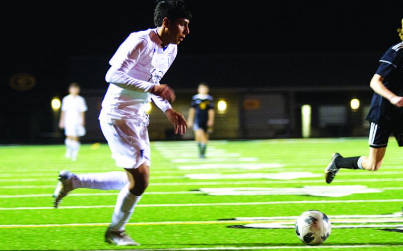 Jose Gomez dribbles in the box before getting a shot away against the Gatesville Hornets. HUNTER KING | DISPATCH RECORD