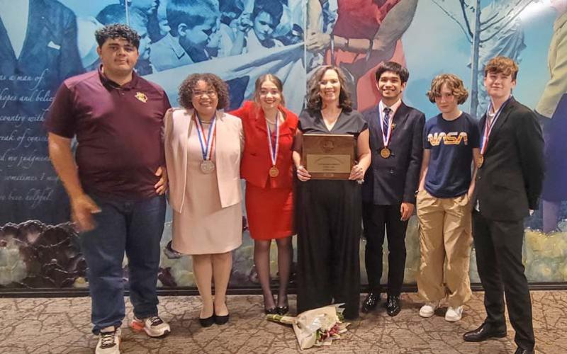 Pictured left to right are speech and debate competitors Lamar Linton, Sholee Turner, Jewel Groves, coach Cheri Jay-Wienecke, Bao Nguyen, Liberty Potts and Wyatt Potts. COURTESY PHOTO