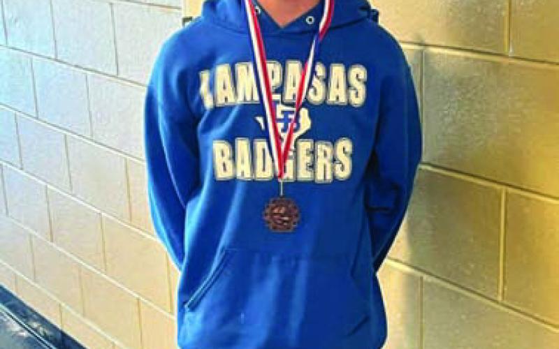 Kayden Biggars shows off his third-place medal for ready writing. COURTESY PHOTO