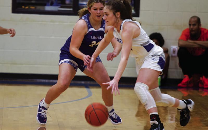 Kenna Davis plays tough defense on the Jarrell ball handler during Tuesday’s game. HUNTER KING | DISPATCH RECORD