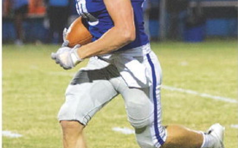Brock Langford returns an interception in last Friday’s game. HUNTER KING | DISPATCH RECORD