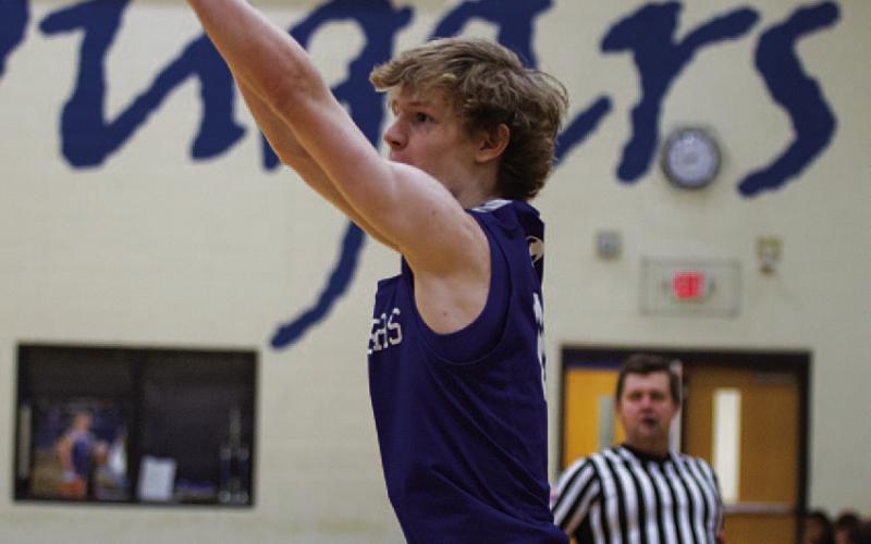 HUNTER KING | DISPATCH RECORD Peyton Sisson releases a three-point shot in the fourth quarter of last Friday’s game.