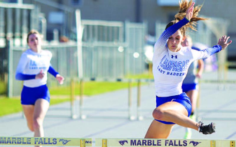 HUNTER KING | DISPATCH RECORD Nyla Long clears the final obstacle in the 300-meter hurdles.