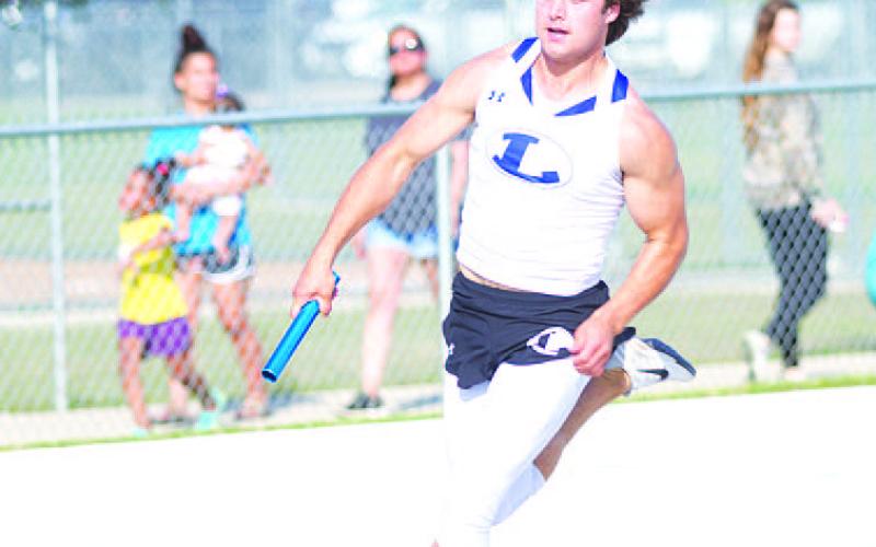 Aden Rascoe rounds a curve during the relays in Marble Falls last Thursday. HUNTER KING | DISPATCH RECORD