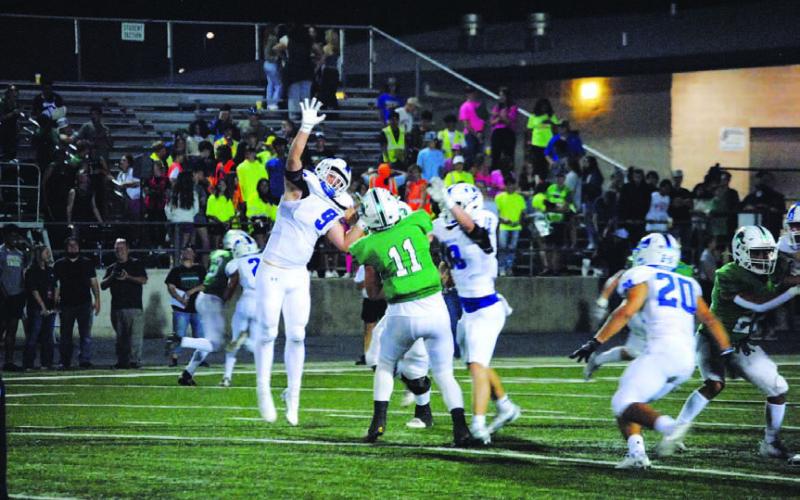 Brady Renfrew leaps to try and knock down a pass against Burnet last week. HUNTER KING | DISPATCH RECORD