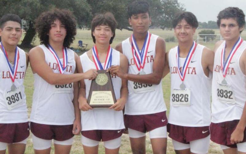 JESSICA MALDONADO | DISPATCH RECORD The Lometa boys’ cross country team poses with a trophy and medals after finishing second at the district cross country meet in Lometa.