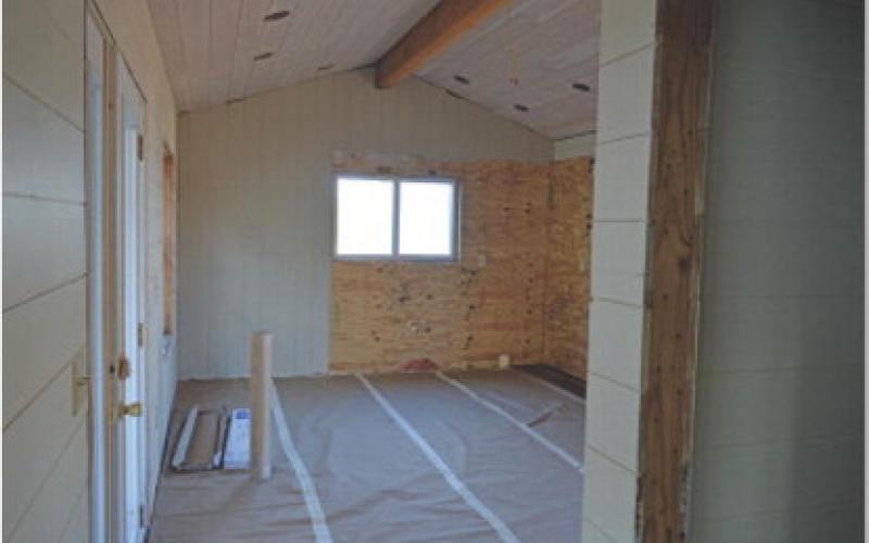 Interior walls are up, and doors and windows are installed. Students will complete the wood trimwork over the next several months of the project. erick mitchell | dispatch record