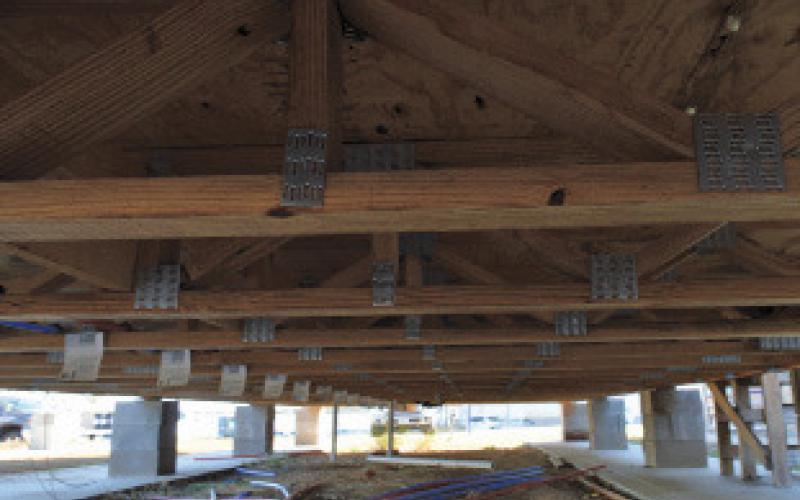 erick mitchell | dispatch record Students worked on floor trusses to level the tiny home under the tutelage of Creating Badger Builders mentors Rex Keele and Steve Hudson.