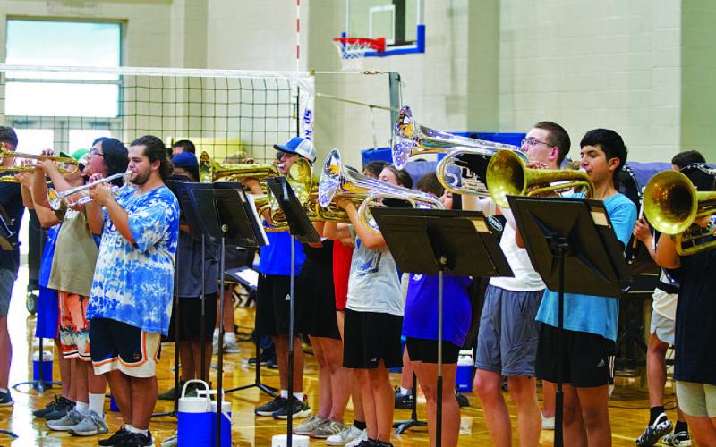 The brass section raises the roof at the final Lampasas High School Badger Band summer rehearsal on Monday evening. HUNTER KING | DISPATCH RECORD