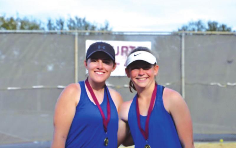 Kailr Clements, left, and Abby Valdez, pose with their first-place medals after winning in Brownwood last week. COURTESY PHOTO