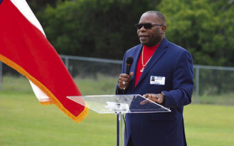 Retired Army veteran Terwan Crowley gives an address to Taylor Creek Elementary School students on the importance of first responders and U.S. military members. ERICK MITCHELL | DISPATCH RECORD