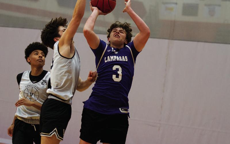 HUNTER KING | DISPATCH RECORD Aidan Nuckles shoots a contested shot over a Vandergrift defender during Wednesday’s action.
