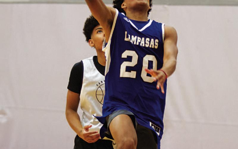HUNTER KING | DISPATCH RECORD Angel Scott lays the ball up in a summer league game.