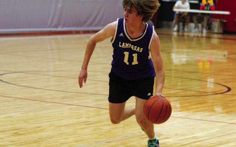 HUNTER KING | DISPATCH RECORD Jax Pratus drives toward the basket.