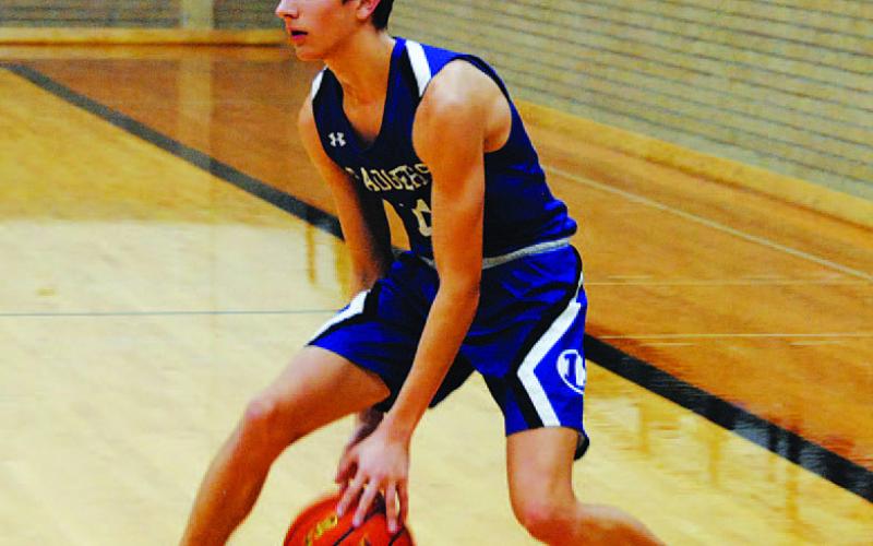 Luke Shivers dribbles in isolation before attacking the basket. HUNTER KING | DISPATCH RECORD