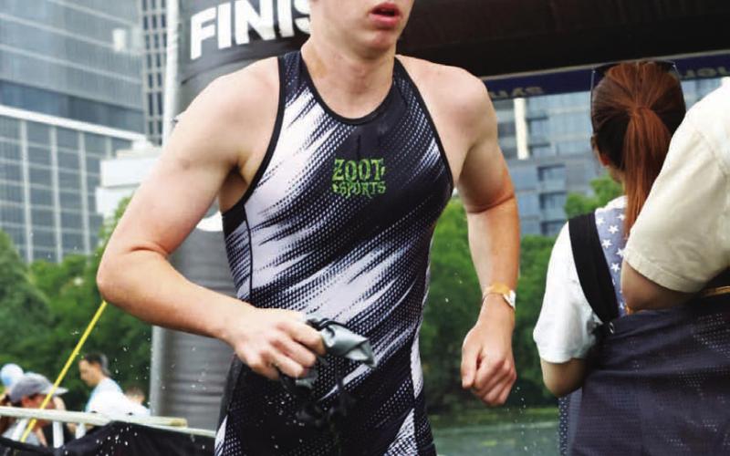 COURTESY PHOTO Gabriel Allison runs out of the water after a swim portion during a triathlon.