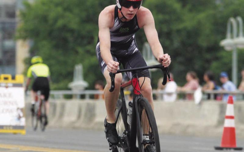 COURTESY PHOTO Biking is the second of the three events during the triathlon.