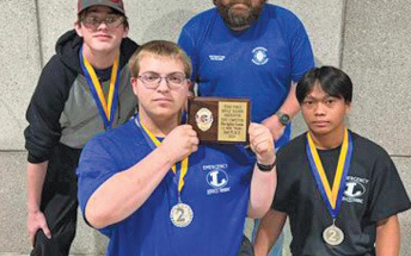 The LHS fire agility team took home silver at the state competition. Pictured, back row, from left, are Tony Carey and instructor Steve Haviland; front row, Joseph Walden and JD Obeda. erick mitchell | dispatch record