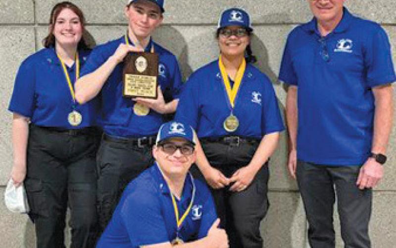 The LHS state-champion traffic stop team includes, from left to right, Lily Stephen, Jason Brock, Lena Jeffries, instructor Michael Tatum and Bryce Neely, kneeling front and center. erick mitchell | dispatch record