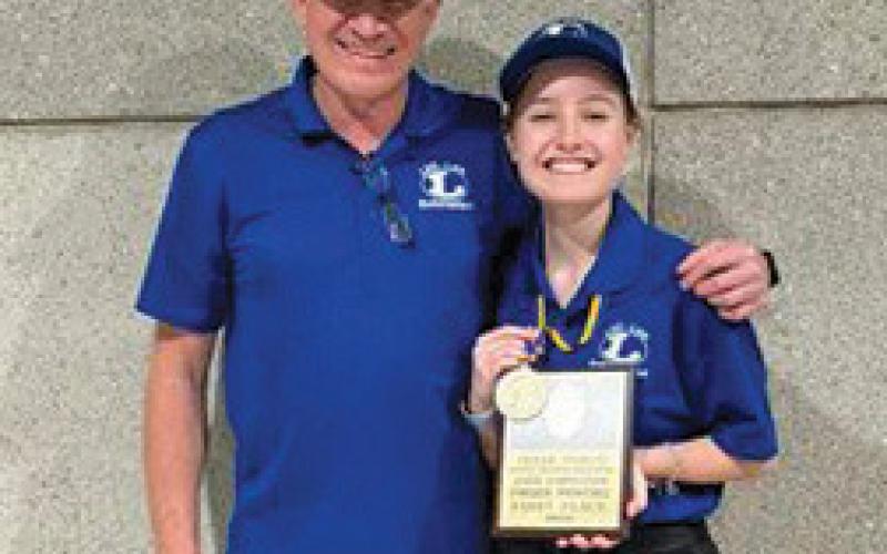 Brice Miller was named state champion of the fingerprint lifting competition. He is pictured at right, alongside his instructor, Michael Tatum. erick mitchell | dispatch record