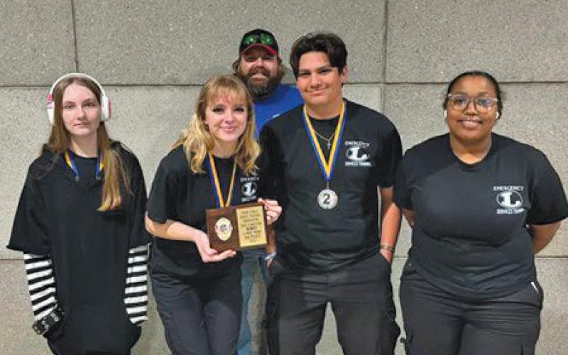 The LHS EMT team earned second place at the state competition. Pictured, left to right, are students Abigail Bell, Sarah Rouss, Ben Ybarra and Jakiyra Taylor. Instructor Steve Haviland stands behind them. erick mitchell | dispatch record