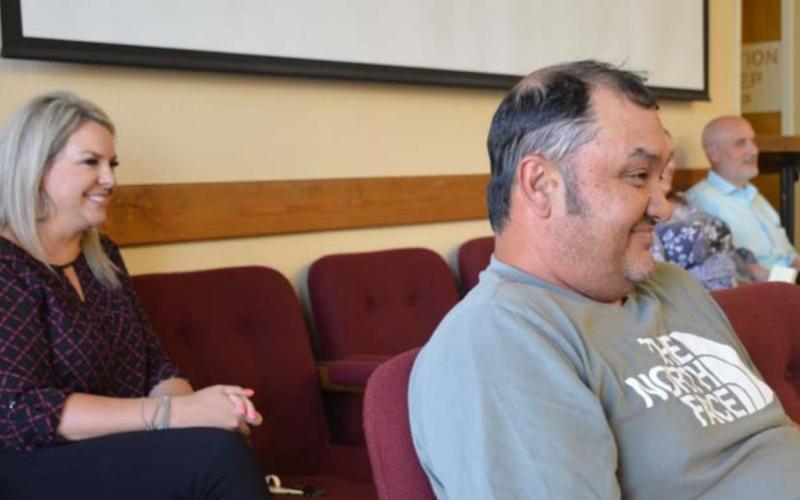 School board candidates Kelsi Davis and Harvey Stinnett listen to school officials explain their election options during a May 19 special school board meeting, after the May 7 trustee election ended in a tie. MONIQUE BRAND | DISPATCH RECORD