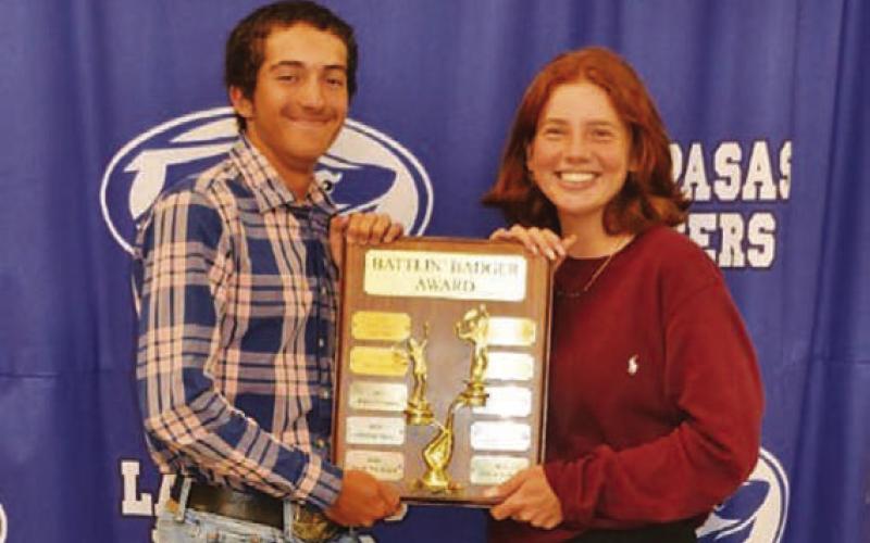 COURTESY PHOTO | KENNETH PEISER Brock Messinger, left, and Allison Valdez receive the Battlin’ Badger award.