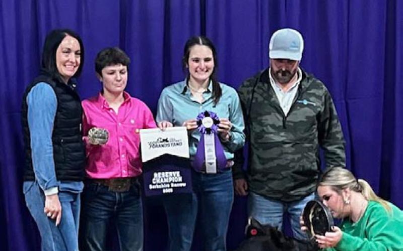 Lampasas FFA member Cole Rutland exhibited the reserve champion Berkshire barrow at the Hill District Grandstand Livestock Show in Kerrville. The pig made the sale and was scheduled to sell over the weekend in Fredericksburg. COURTESY PHOTO