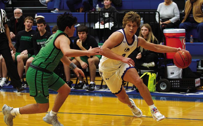 HUNTER KING | DISPATCH RECORD Haegan Oncken dribbles past the Burnet defender in last Friday’s game.